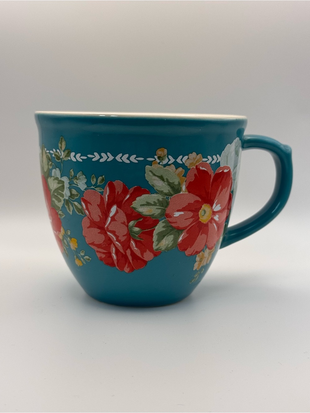 The Pioneer Woman Teal Floral Ceramic Coffee Cup.